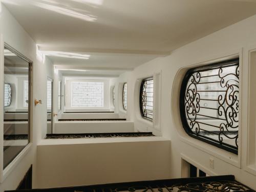 a bathroom with a mirror and a window at LA MER Homestay Quynhon in Quy Nhon
