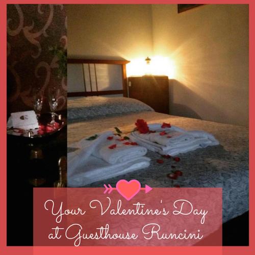 a room with a bed with towels on it at Guesthouse Runcini in Ferentillo