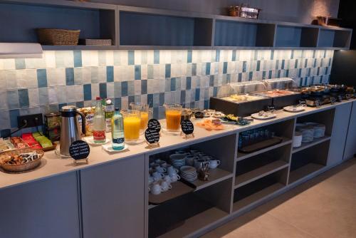 a buffet with a lot of food and drinks at Hotel Garbi in Calella de Palafrugell
