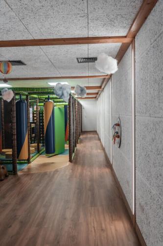 a hallway of a room with skateboards on the wall at Berghotel Arthurhaus in Mühlbach am Hochkönig