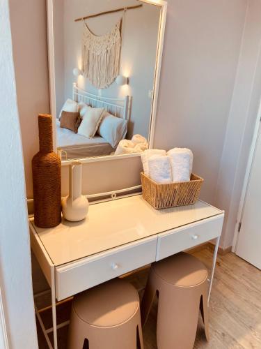 a dressing table with a mirror in a bedroom at KIPOS-SS residences in Dassia