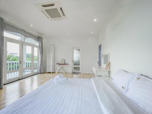 Cama o camas de una habitación en Chang HomeStay Phan Thiết Villa SeaLink&Ocean Vista------------------------------------------------------Căn Hộ Sát Biển-------------Long-Term Rental----------Monthly Rental-------------------------------------------------------GGle CHANG HOMESTAY Mui Ne