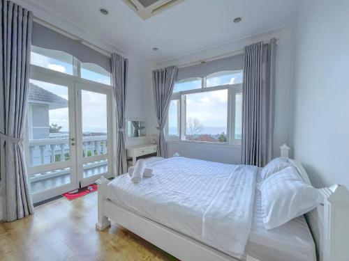 Cama o camas de una habitación en Chang HomeStay Phan Thiết Villa SeaLink&Ocean Vista------------------------------------------------------Căn Hộ Sát Biển-------------Long-Term Rental----------Monthly Rental-------------------------------------------------------GGle CHANG HOMESTAY Mui Ne