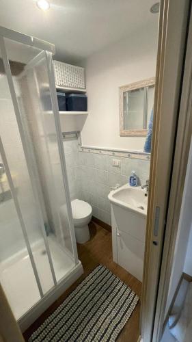 a bathroom with a shower and a toilet and a sink at Dreaming Cefalù in Cefalù