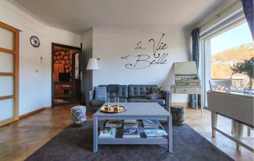 a living room with a couch and a table at Beautiful Apartment In Bouillon in Bouillon