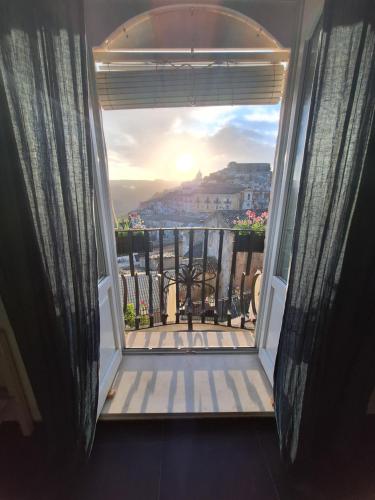 a balcony with a view of a city at Bed and Breakfast Terra del Sole Ibla in Ragusa