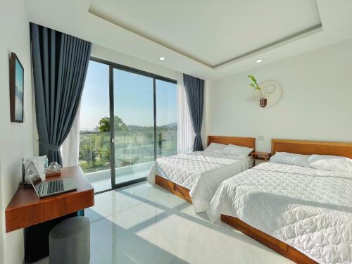 Photo de la galerie de l'établissement Blue Star Viên Hotel, à Binh Tien