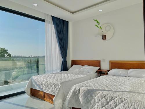 Photo de la galerie de l'établissement Blue Star Viên Hotel, à Binh Tien