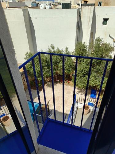 a balcony with a view of a yard at Alba in Sliema
