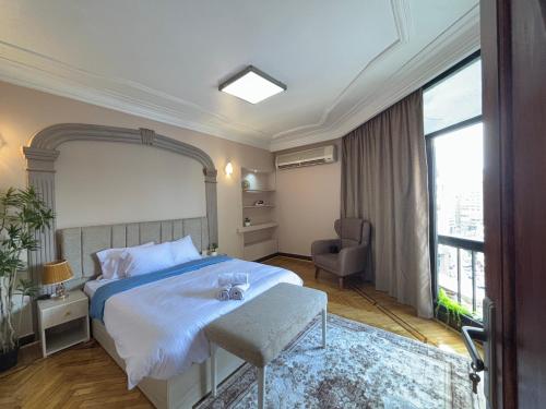Ένα ή περισσότερα κρεβάτια σε δωμάτιο στο Joy Homes Mohandeseen - Families only
