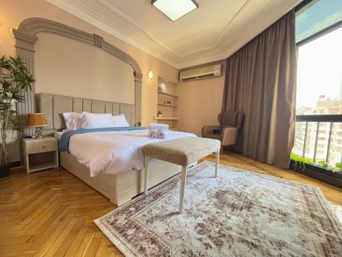 Ένα ή περισσότερα κρεβάτια σε δωμάτιο στο Joy Homes Mohandeseen - Families only