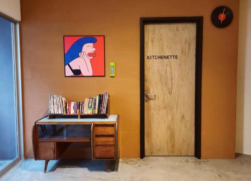 an office with a desk and a door with a picture at Walk-Up To SIAR - Children Not Allowed in Cameron Highlands