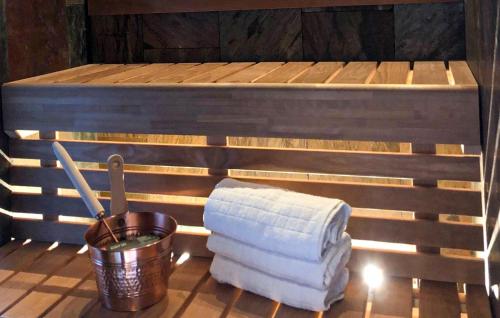 a stack of towels sitting on top of a sauna at Gorgeous Home In Ydre With Sauna in Hult