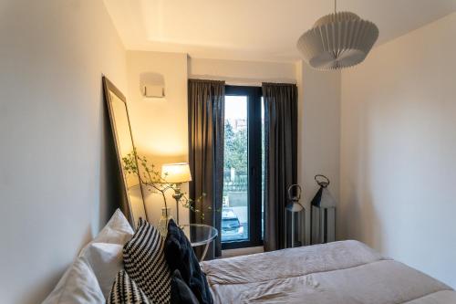 Postel nebo postele na pokoji v ubytování luxusowy apartament w centrum Krakowa