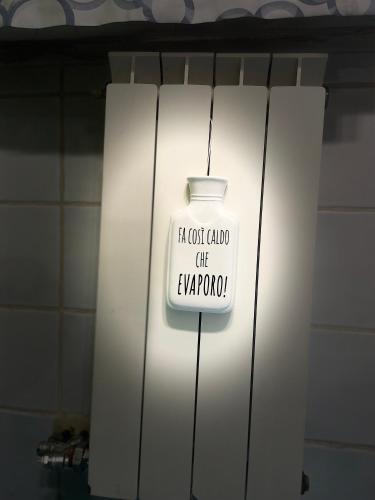 a light with a sign that says not caught fire anymore at Sweet Home MAMA in Monteriggioni