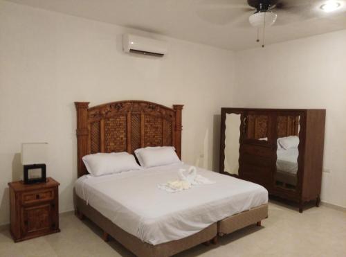 Postel nebo postele na pokoji v ubytování Hotel Hacienda Margot