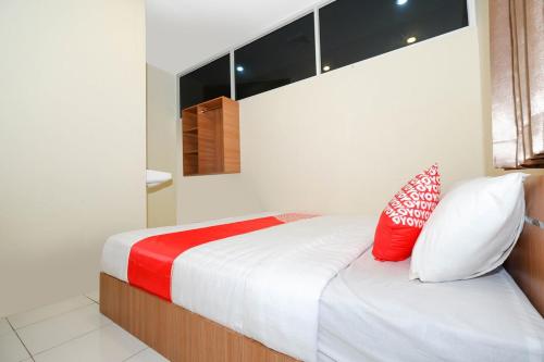 Ένα ή περισσότερα κρεβάτια σε δωμάτιο στο Hotel O Unta Residence