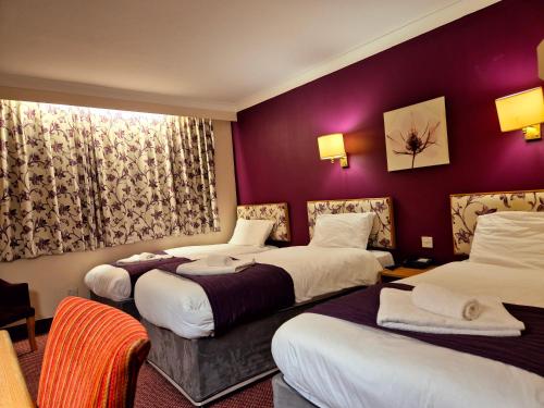 Ένα ή περισσότερα κρεβάτια σε δωμάτιο στο Supreme Inn Boston