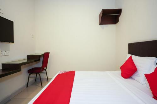Postel nebo postele na pokoji v ubytování Hotel O Jj Hotel Sitiawan