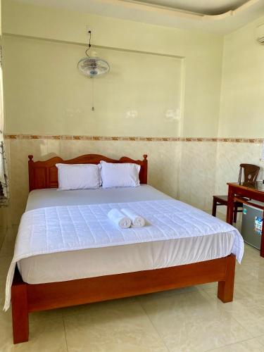 Postel nebo postele na pokoji v ubytování Thanh Trúc Guest House
