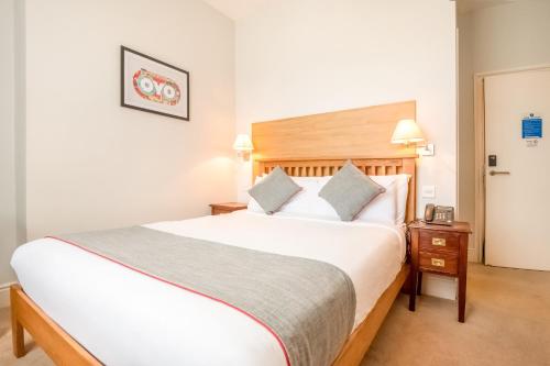 a bedroom with a large bed in a hotel room at The Regency, Clifton Bristol in Bristol