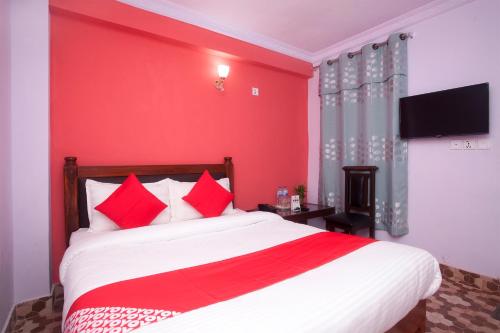 Postel nebo postele na pokoji v ubytování OYO 622 Hotel Khotang