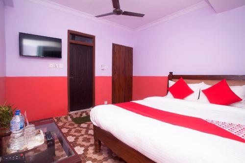 Postel nebo postele na pokoji v ubytování OYO 622 Hotel Khotang