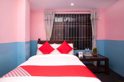 Postel nebo postele na pokoji v ubytování OYO 622 Hotel Khotang