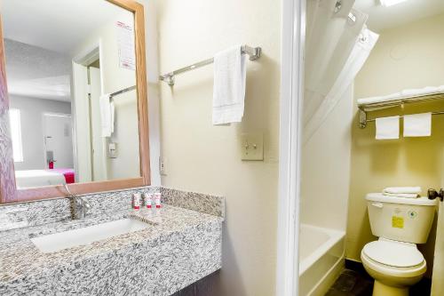 a bathroom with a sink and a toilet at OYO Hotel Eloy Casa Grande near I-10 in Eloy