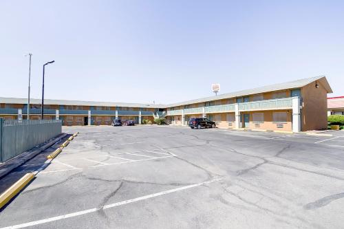 an empty parking lot in front of a building at OYO Hotel Eloy Casa Grande near I-10 in Eloy