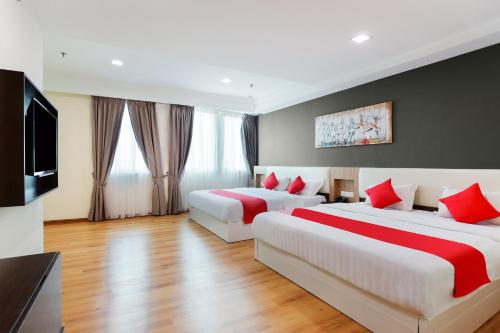 Кровать или кровати в номере Collection O Hotel Super Cowboy