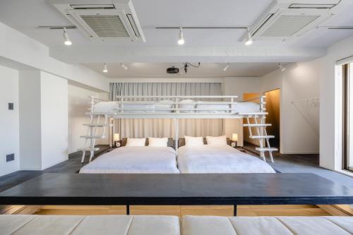 Postel nebo postele na pokoji v ubytování Cocts Akihabara