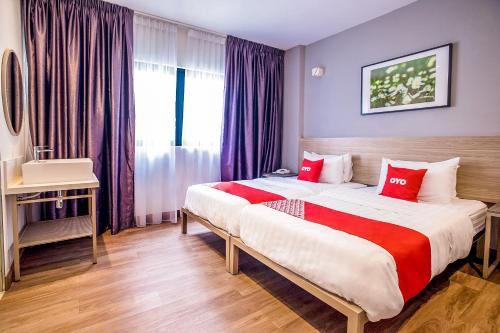 Postel nebo postele na pokoji v ubytování Hotel O Mokka Hotel