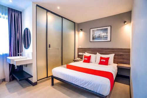 Postel nebo postele na pokoji v ubytování Hotel O Mokka Hotel