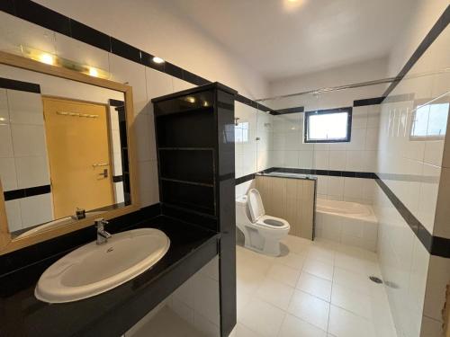 a bathroom with a sink and a toilet at Trekkers Inn Boutique Hotel Pokhara in Pokhara