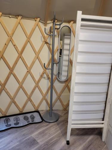 a bathroom with a shower and stairs in a room at Yourte de déconnexion chauffage climatisation in Briollay