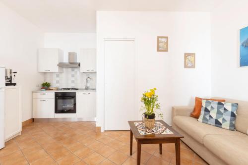 a living room with a couch and a table at Estate4home - Casa Satriano in Positano