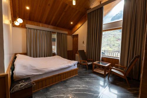 Ένα ή περισσότερα κρεβάτια σε δωμάτιο στο Eden Stay & Cafe