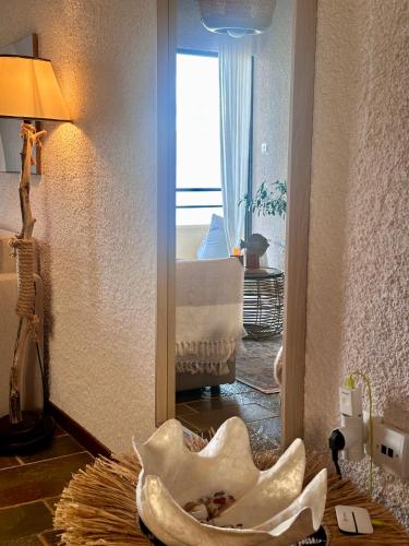a view of a living room with a mirror at SeaTerra Boutique suite in Kalamos