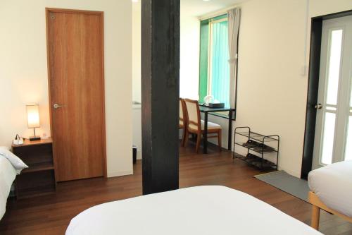 Una cama o camas en una habitación de 彩の宿楓泉