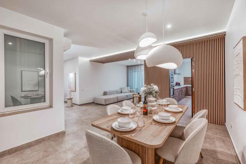 a dining room with a table and chairs at Luxury Apartment in St Pauls Bay w pool by Homely in St. Paul's Bay