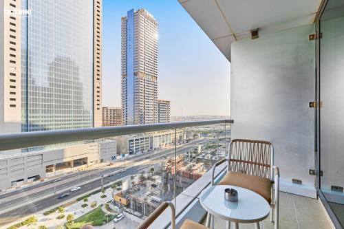 a balcony with a table and a view of a city at bnbmehomes - Gold crest views 2 in Dubai