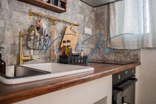 a kitchen with a sink and a counter top at NisiotiKos in Kos Town