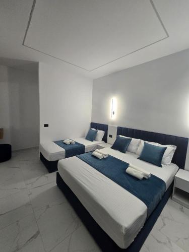 Postel nebo postele na pokoji v ubytování Elite Inn