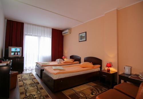 Кровать или кровати в номере Hotel Ciric