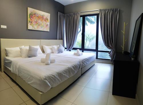 a large bed in a room with a large window at SUPERB Klean & Cozy Midhill in Genting Highlands