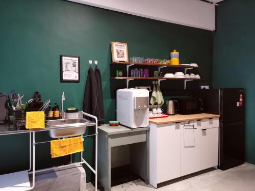 a kitchen with a sink and a counter top at Walk-Up To SIAR - Children Not Allowed in Cameron Highlands