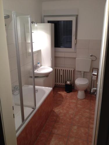 a bathroom with a sink and a toilet at HertenFlats - Apartment Balkon in Herten