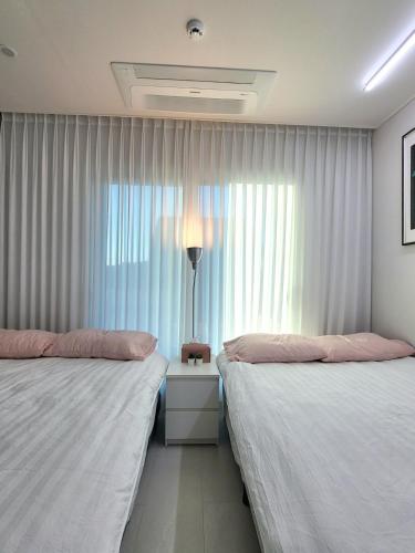 Ένα ή περισσότερα κρεβάτια σε δωμάτιο στο Rest house