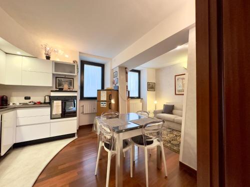 a kitchen and living room with a table and chairs at Belvedere House in Castel Gandolfo